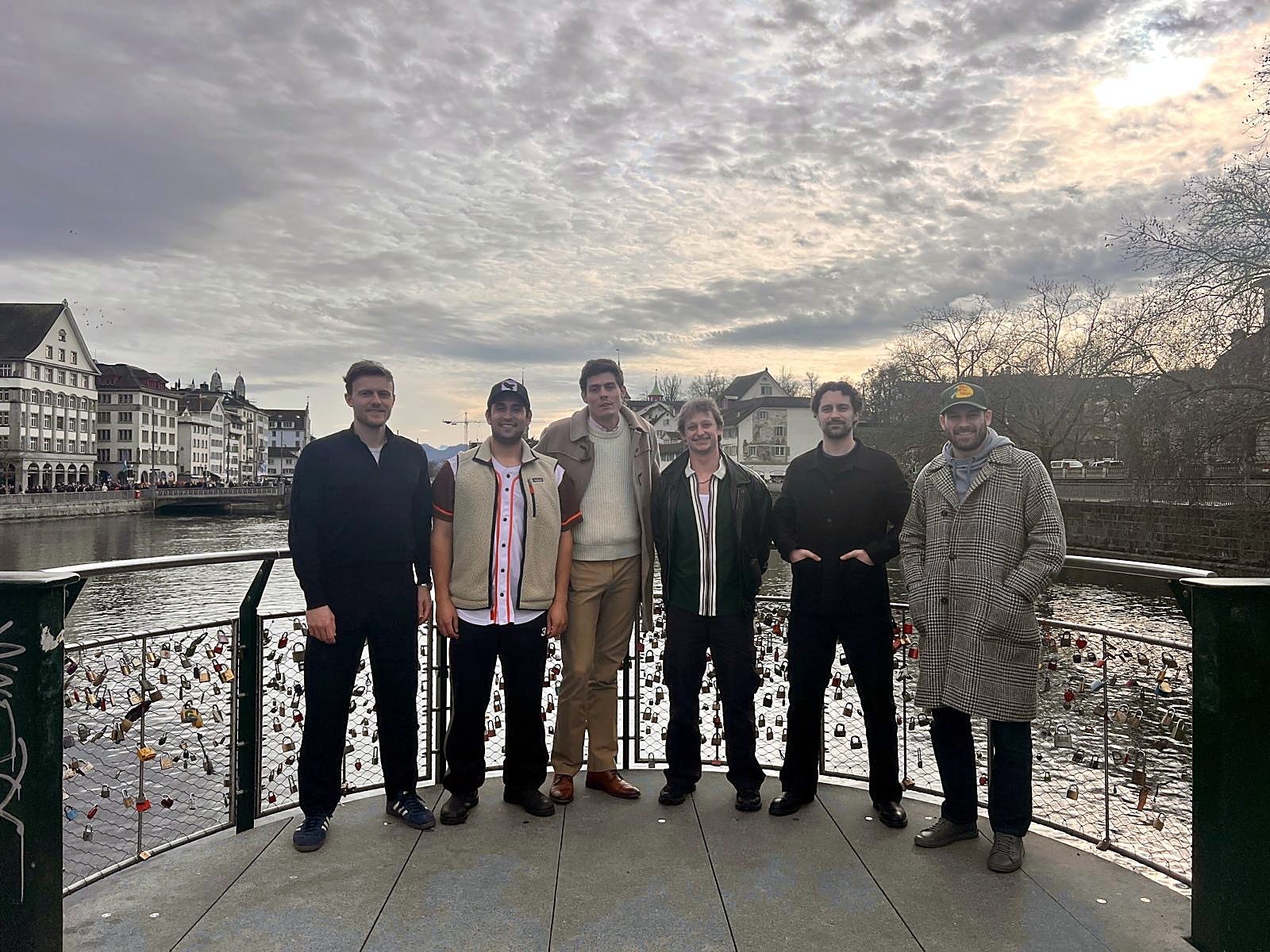 The six founders on a viewing platform above the Limmat in Zurich.